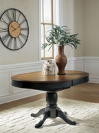 Clorazi - Oval Dining Room Butterfly Extension Table - Black / Brown