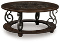 Frallyn - Round Cocktail Table - Dark Brown